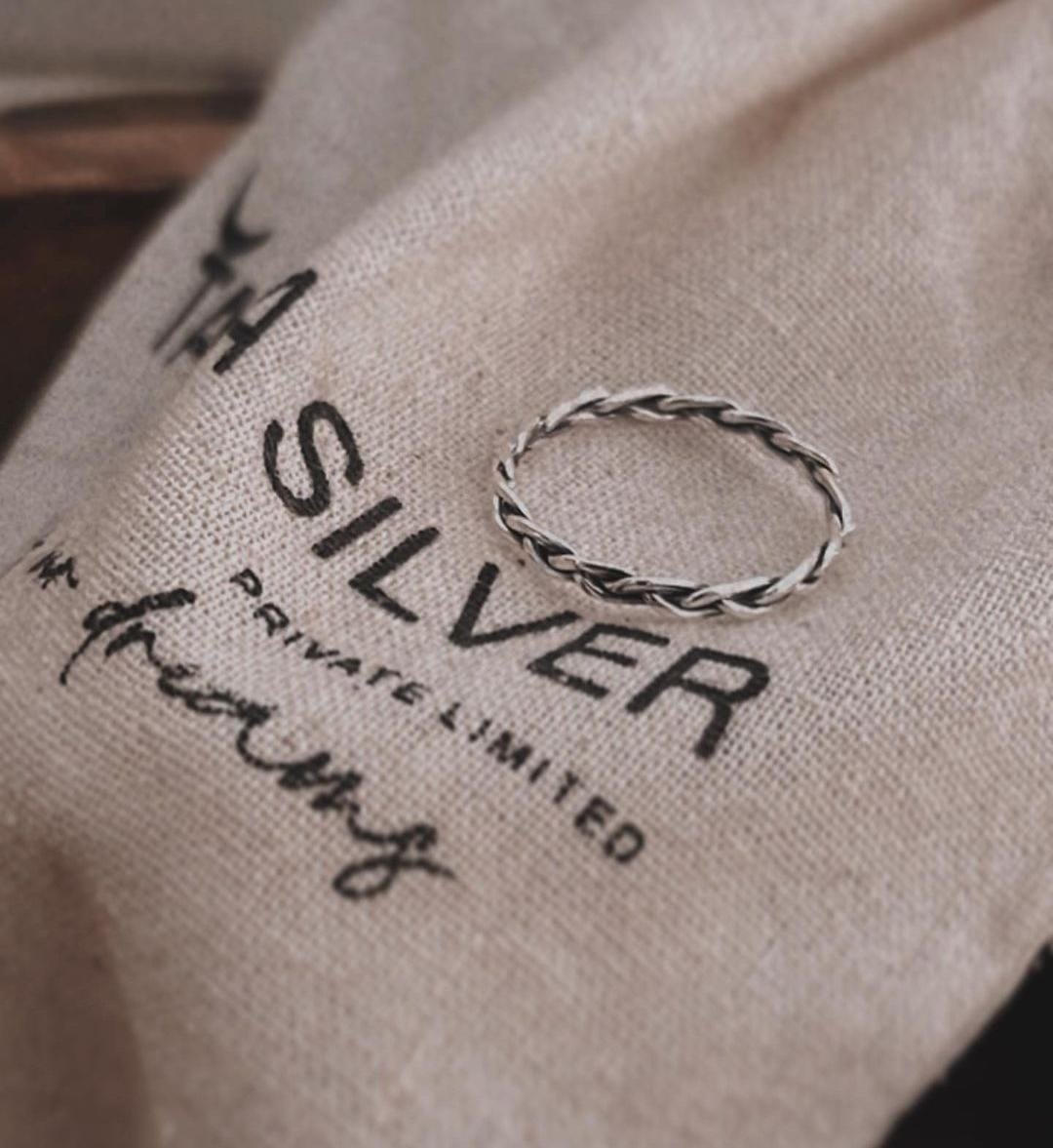 Loose Braided Band Silver Ring with Subtle Sophistication