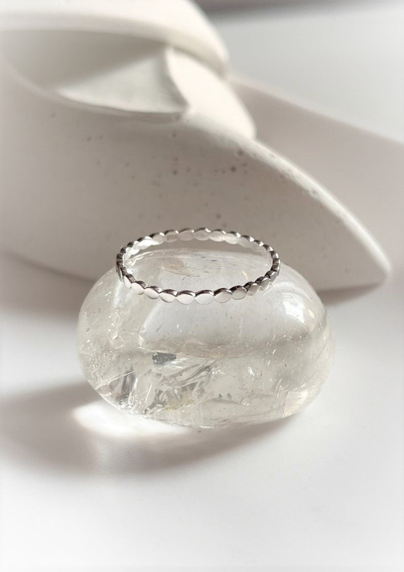 Timeless silver 925 stackable ring featuring a subtle dot band design