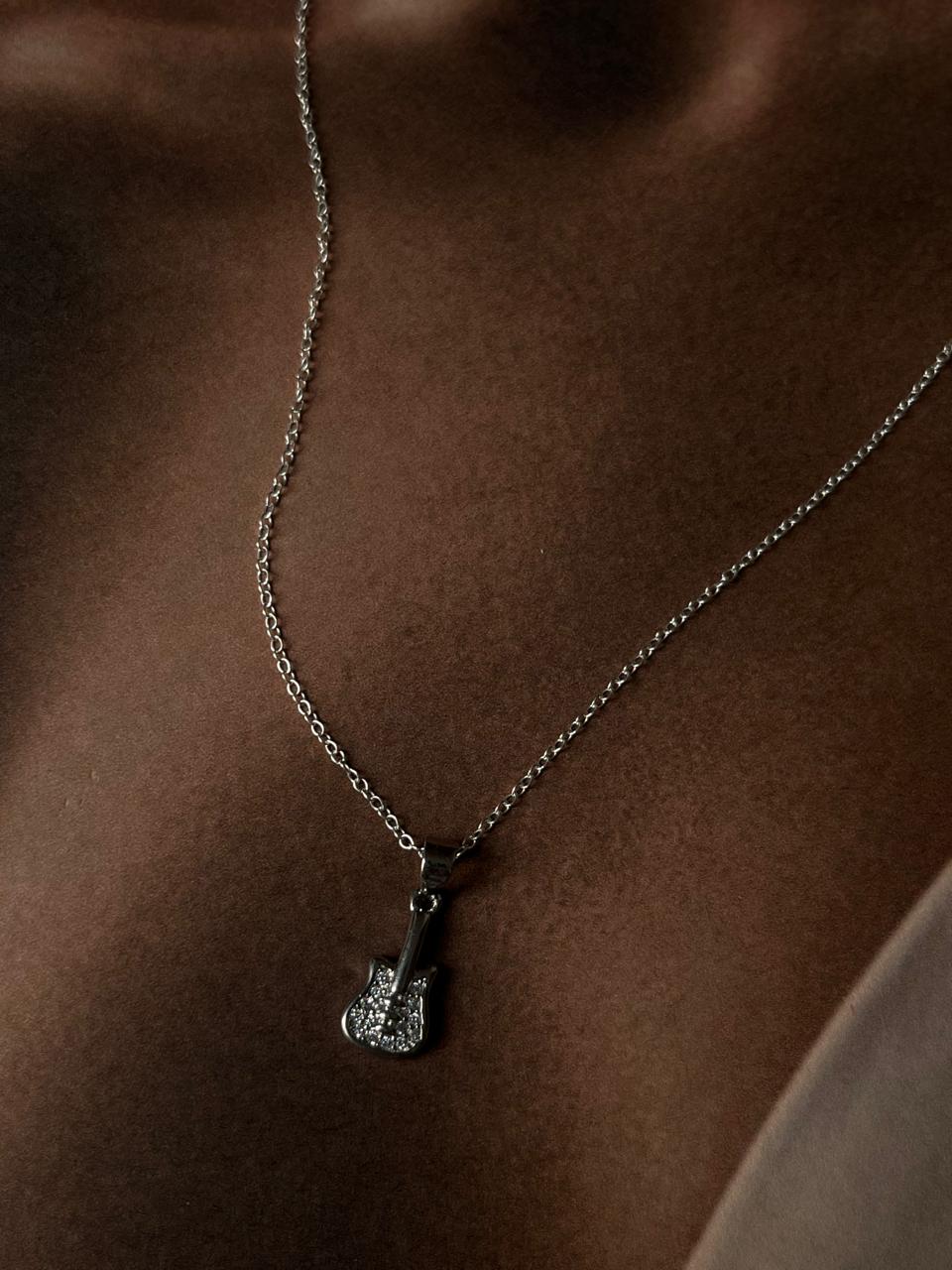 Guitar-shaped pendant necklace in sterling silver