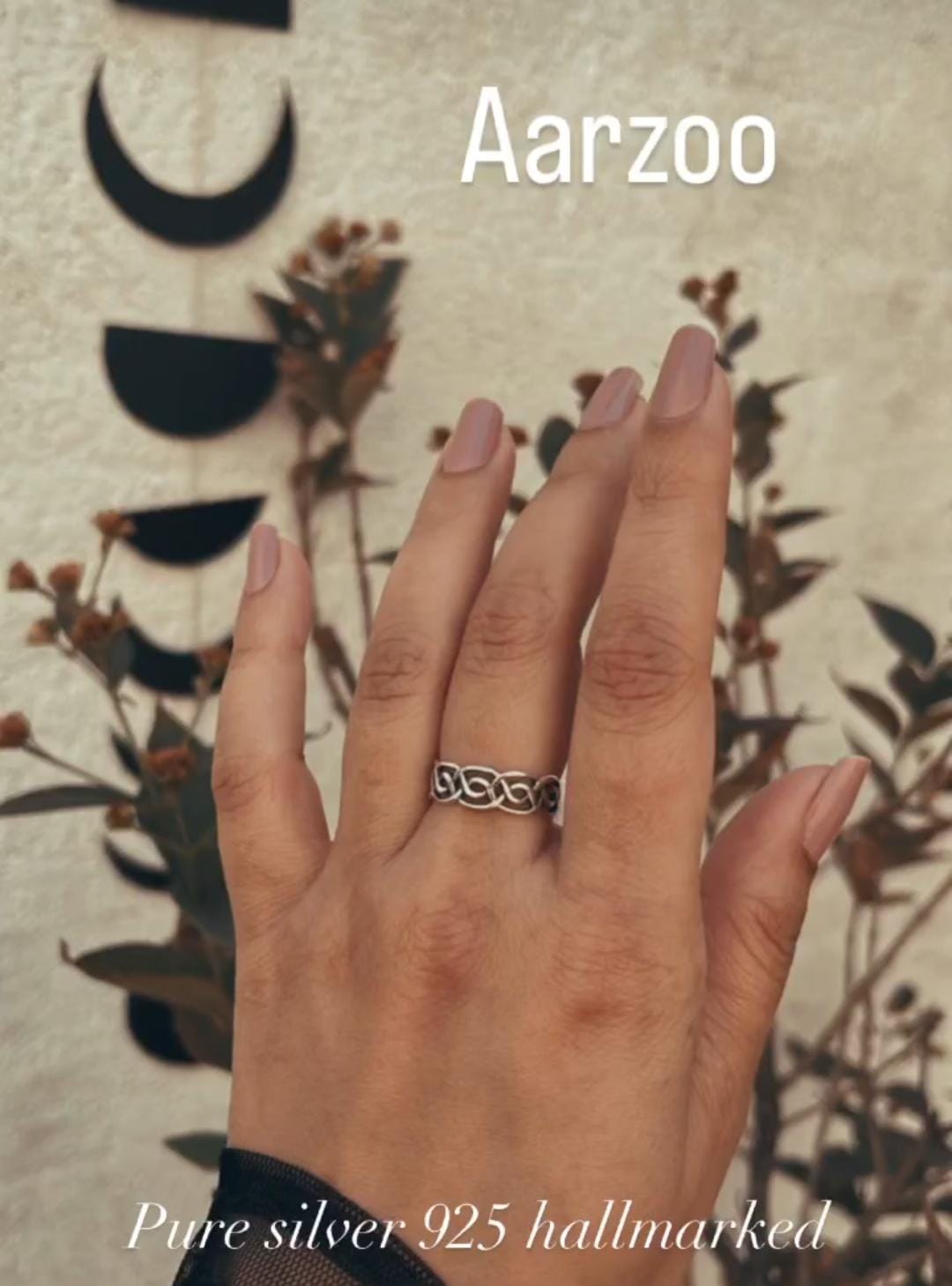 Elegant Arzoo silver ring with intricate detailing.