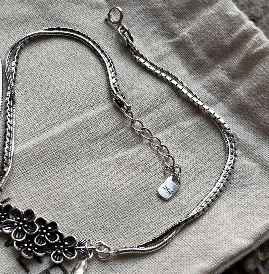 Sophisticated floral drop silver anklet with a polished and refined finish