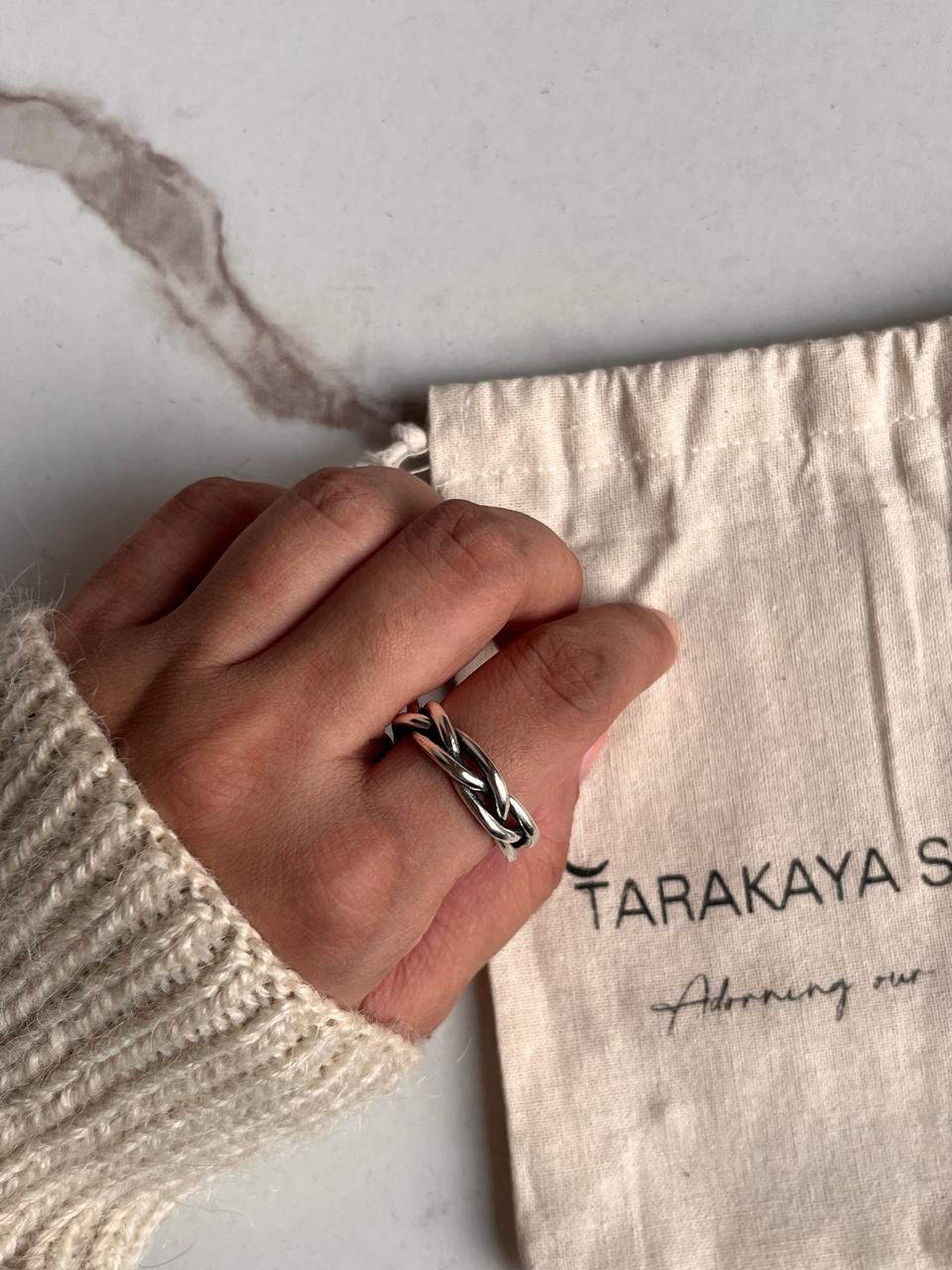 Detailed view of handcrafted chunky twist braided silver ring