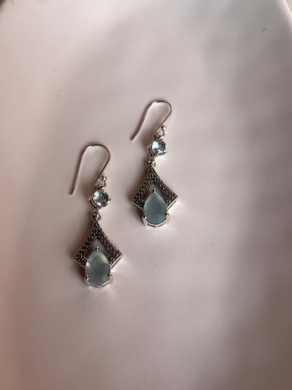 Sophisticated silver earrings with pear-shaped aqua chalcedony and blue topaz stones.