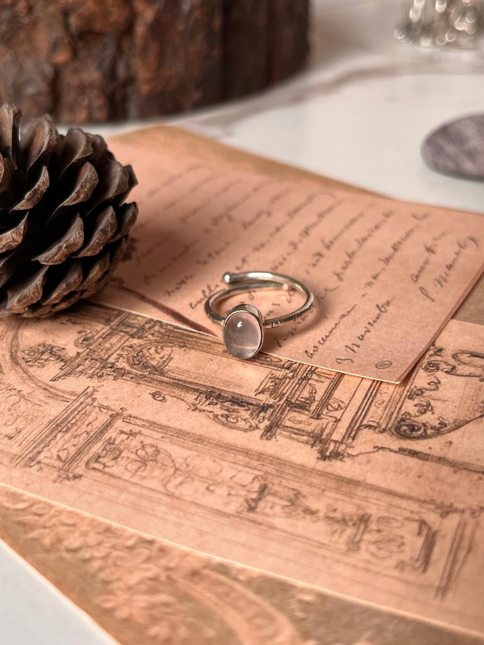 Elegant rose quartz oval ring with tribal engravings in sterling silver