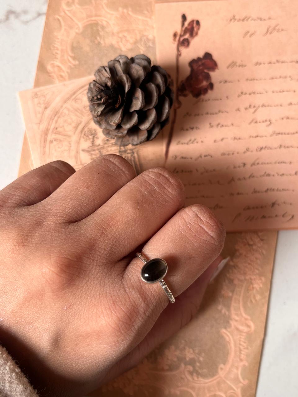Handcrafted smokey quartz oval ring with tribal silver details