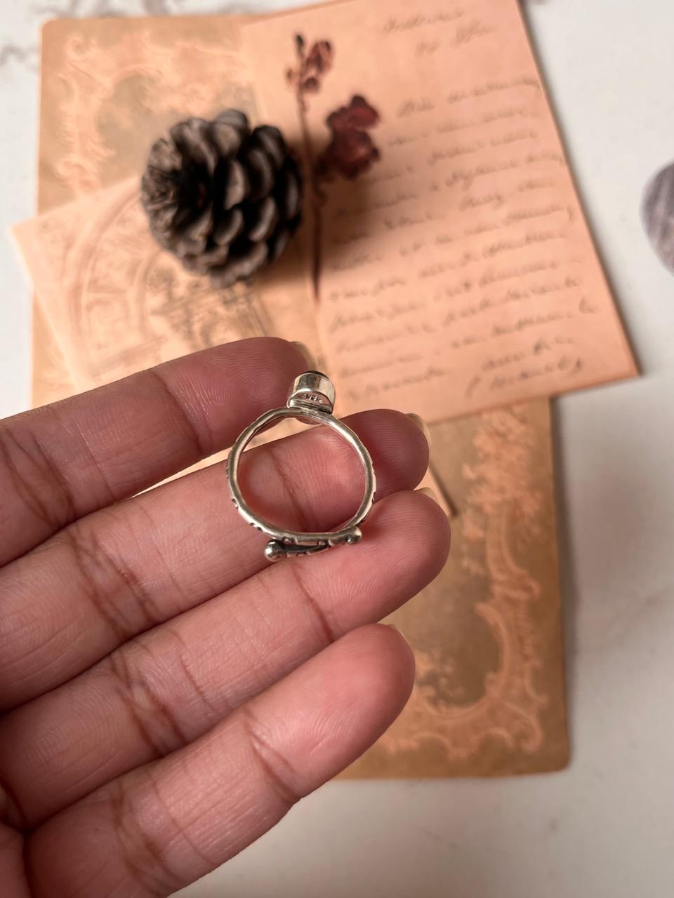 Tribal engraved silver ring featuring smokey quartz oval stone