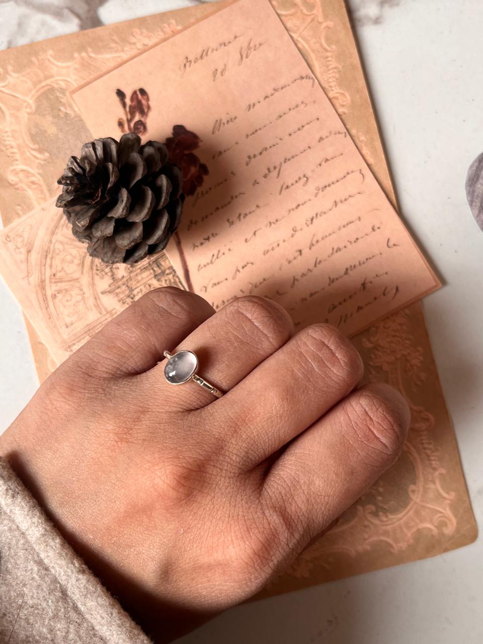 Timeless rose quartz oval ring with tribal engraving and adjustable band