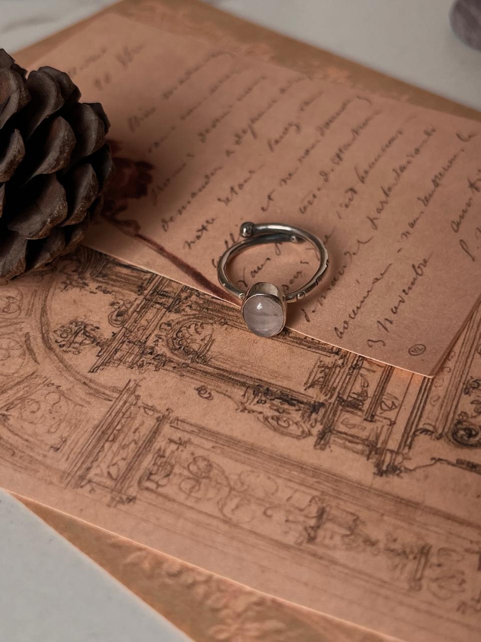 Handcrafted adjustable silver ring with rose quartz and tribal design