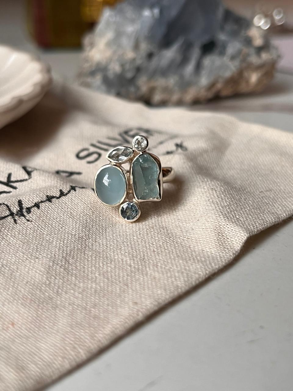Handcrafted aquamarine and blue topaz cluster ring with 4 stones