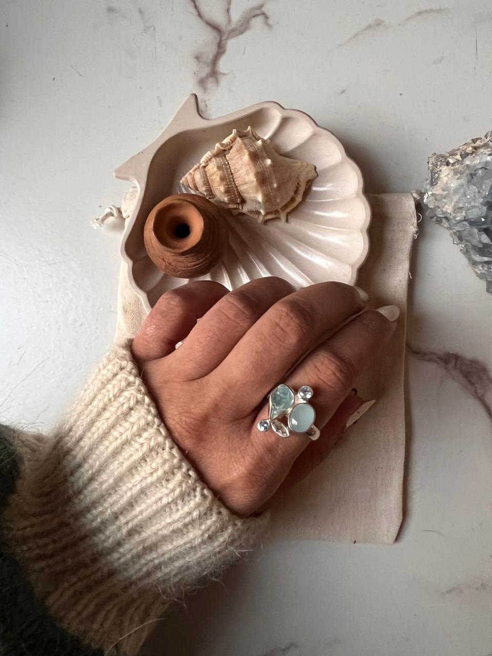 Aquamarine and blue topaz stones in a cluster design silver ring