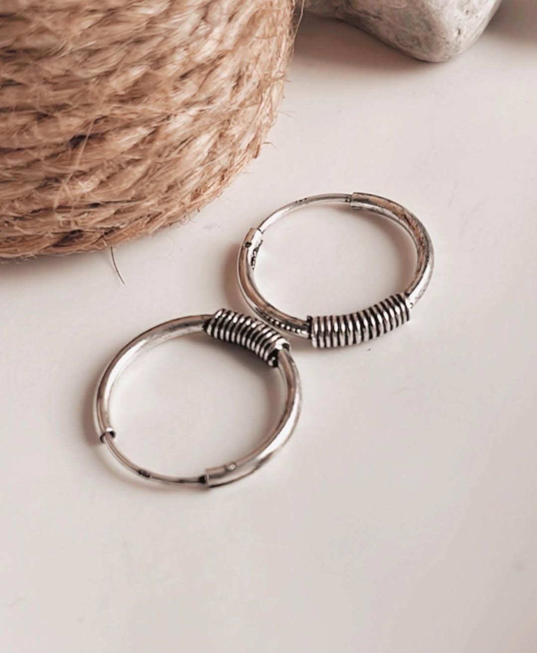 Vintage-style oxidised silver hoop earrings with wire wrapping