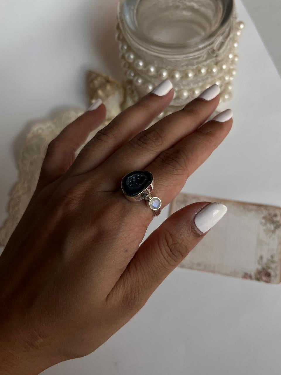Handcrafted silver ring featuring blue coconut druzy and moonstone
