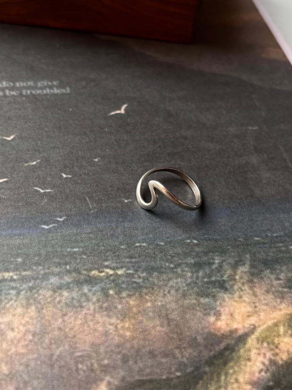 Beach-inspired silver ring with wave texture