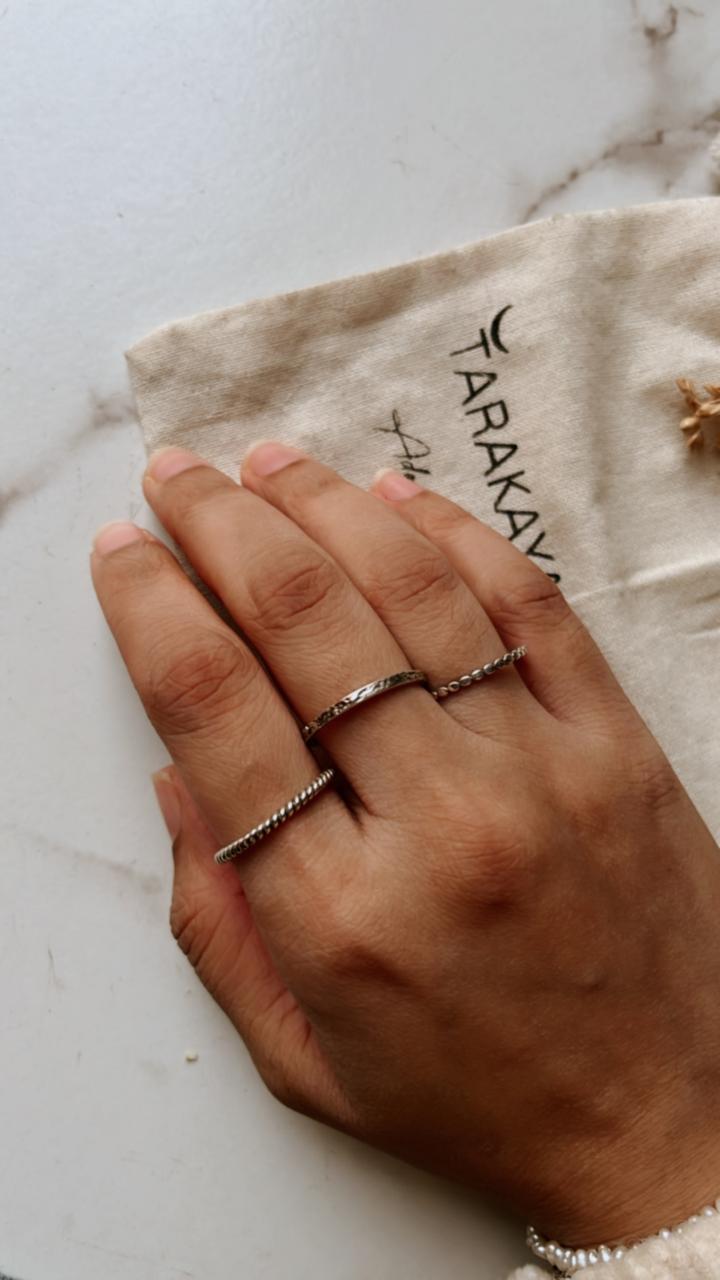 Classic rope, dot, and textured silver stack rings for a bold look