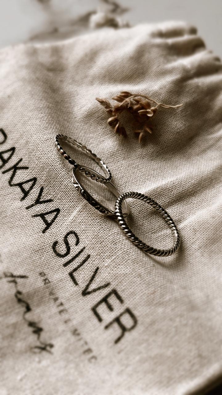 Small dot and rope textured silver stacking ring set