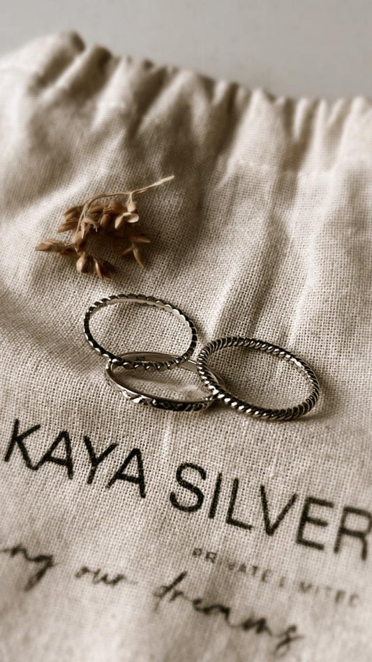 Small dot, textured band, and classic rope stack set silver ring