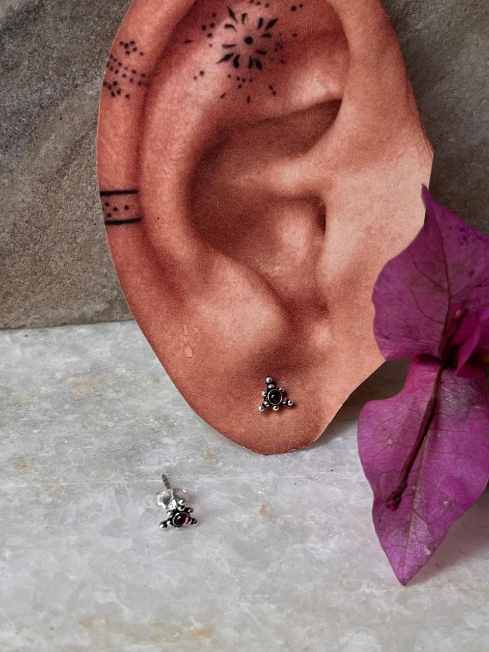 Ethnic rawa design sterling silver studs with pink cubic zirconia