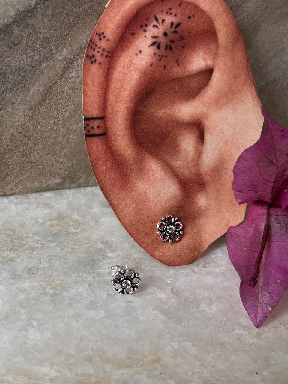 Stylish sterling silver floral studs with white CZ sparkle