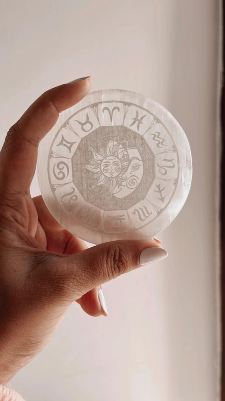 Selenite crystal charging plate featuring Zodiac symbols