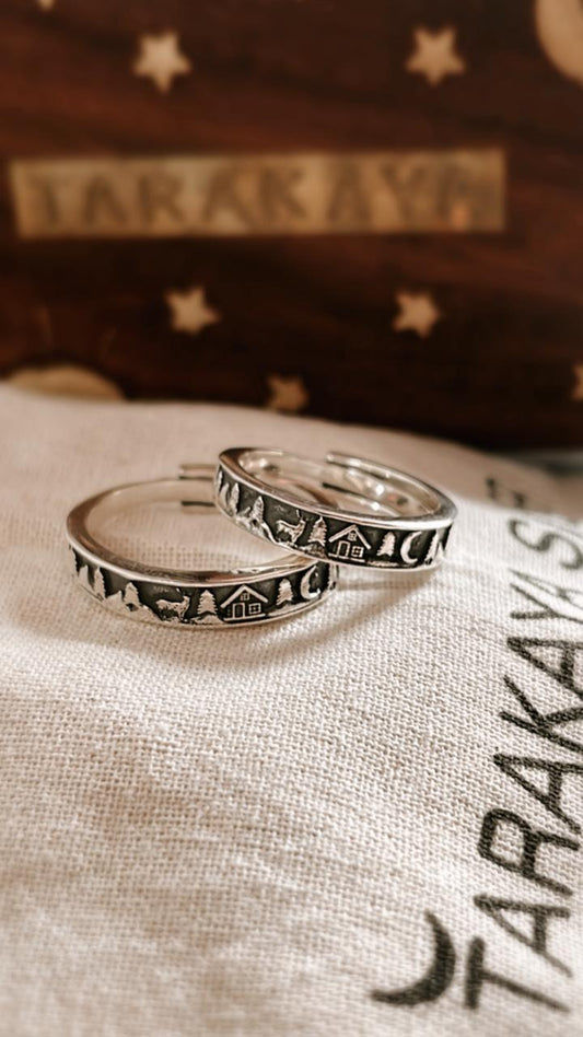 Couple adjustable silver ring featuring forest reindeer moon cottage design