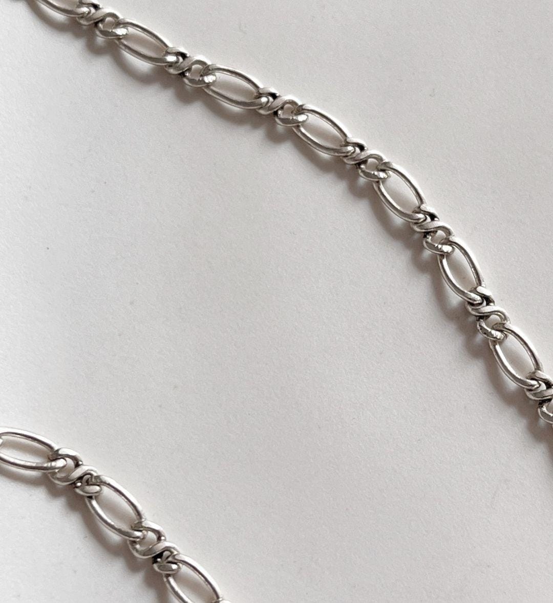 Timeless Figaro silver chain featuring a sleek, polished finish