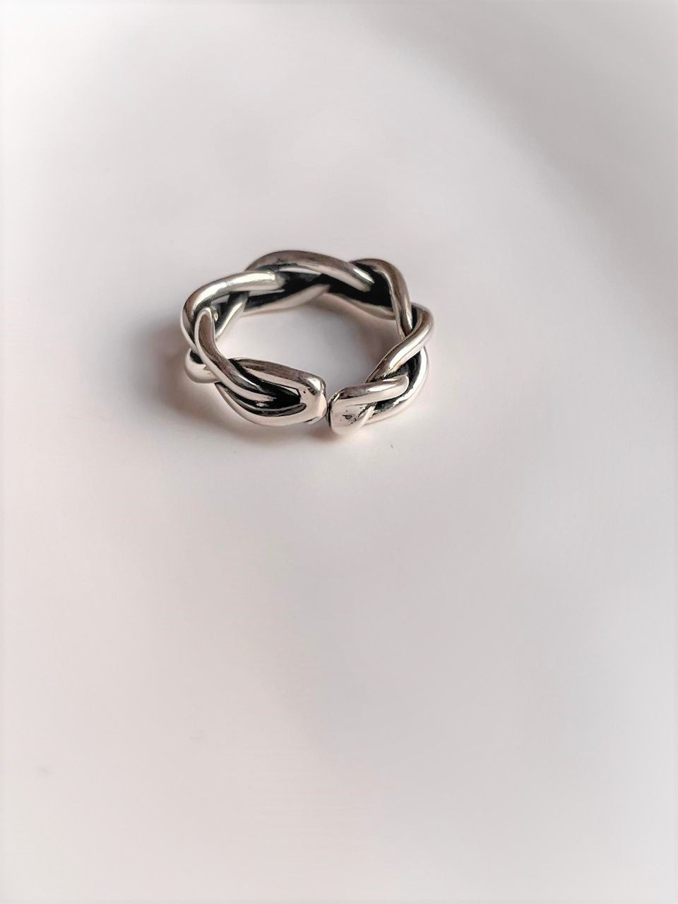 Handcrafted adjustable silver 925 ring with twisted braided pattern