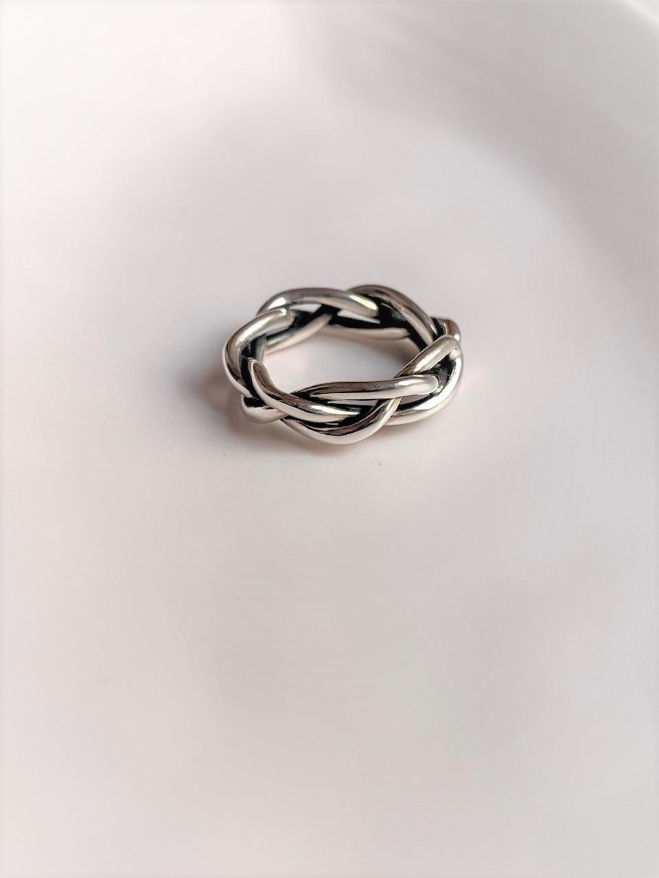 Bold and elegant adjustable silver 925 ring with twist braided design