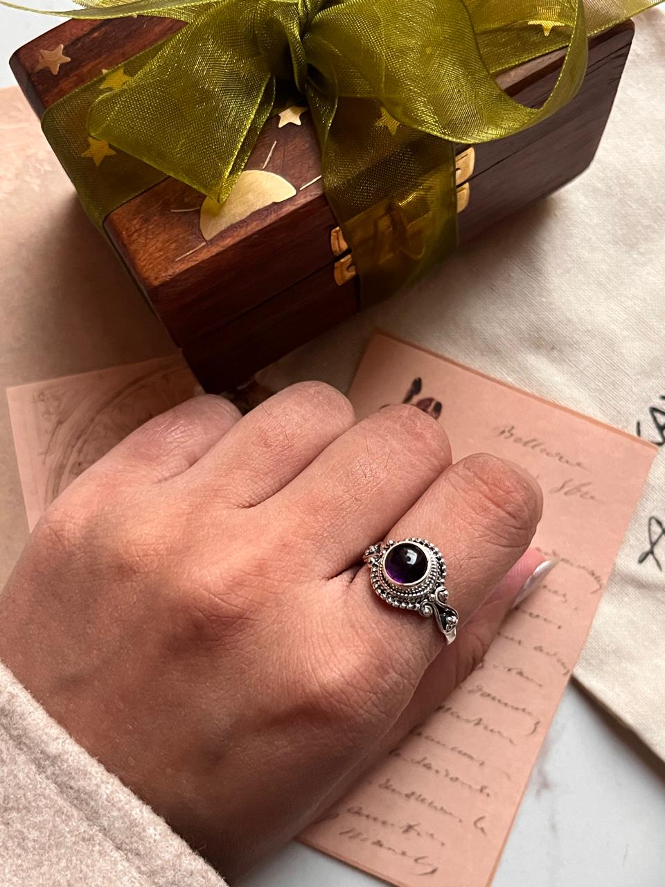 Unique round amethyst ring in a boho silver setting.