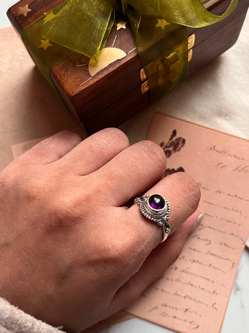 Stylish round amethyst ring with a bohemian silver design.