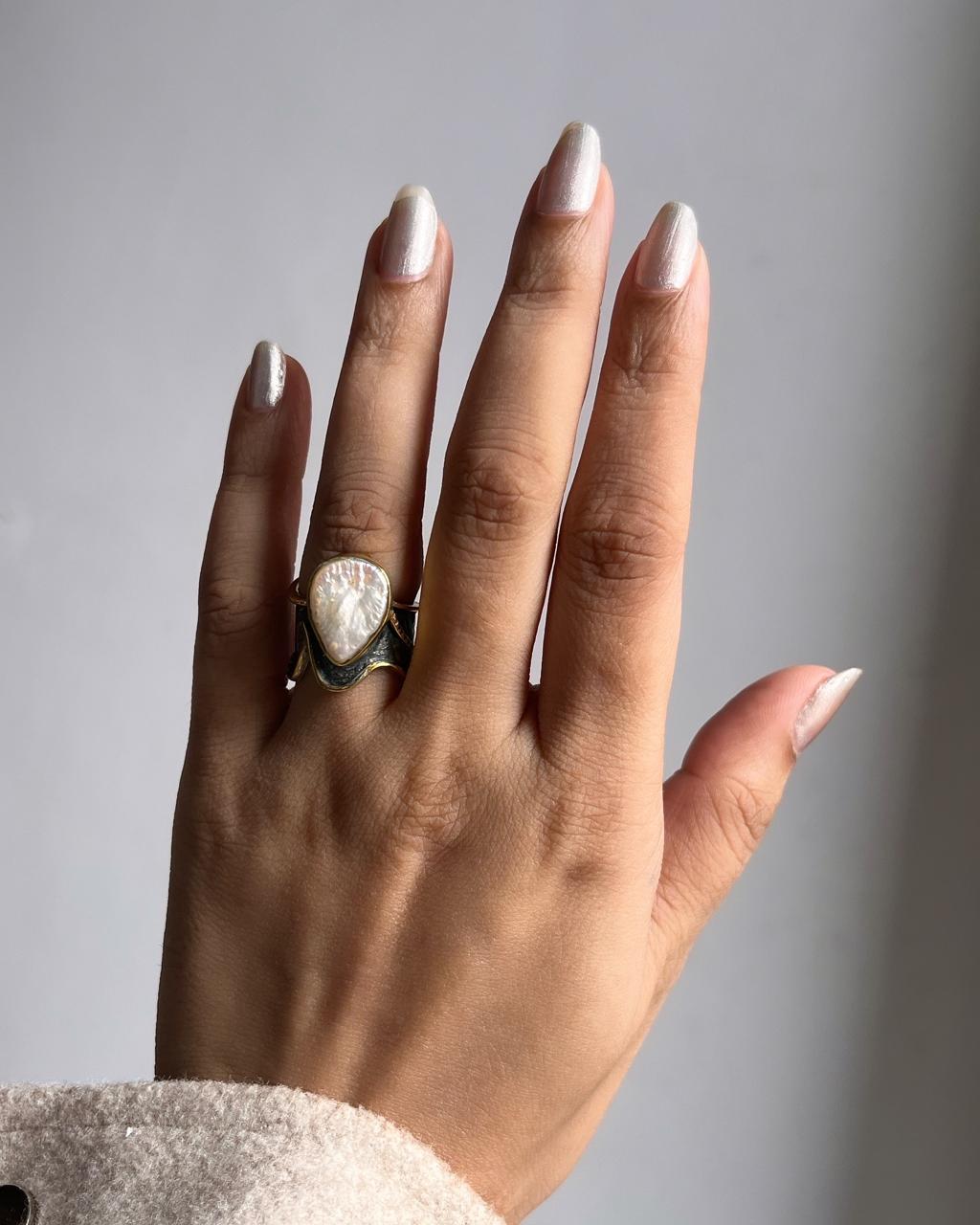 Elegant Baroque pearl set in a rustic sterling silver ring.