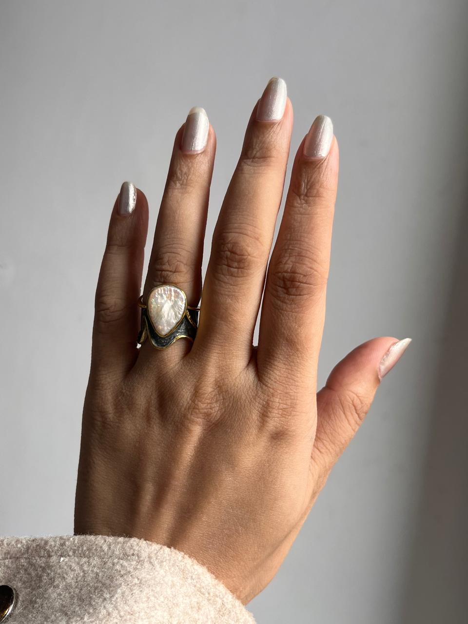 Charming rustic silver ring featuring a one-of-a-kind Baroque pearl.