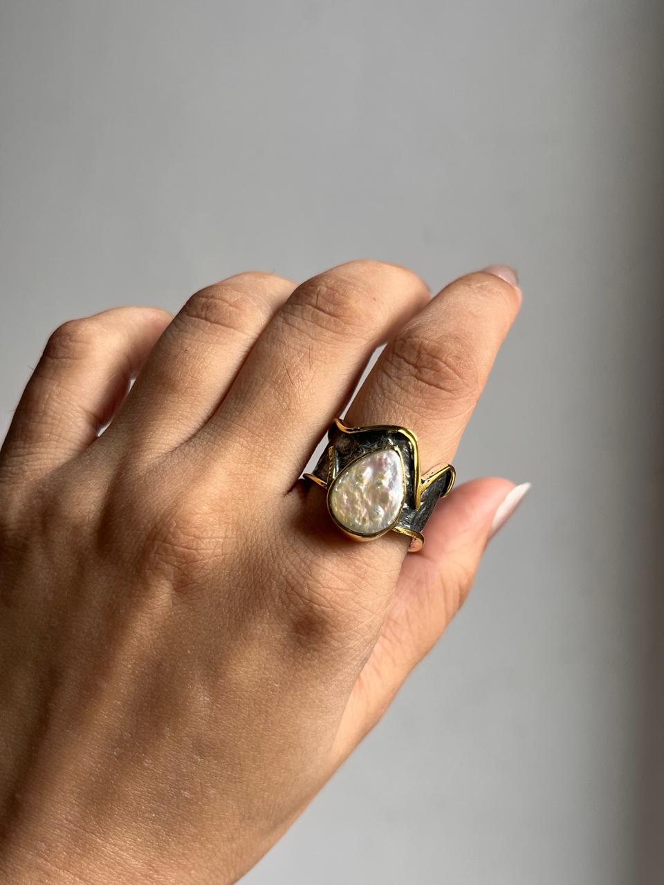 Elegant Baroque pearl set in a rustic sterling silver ring.