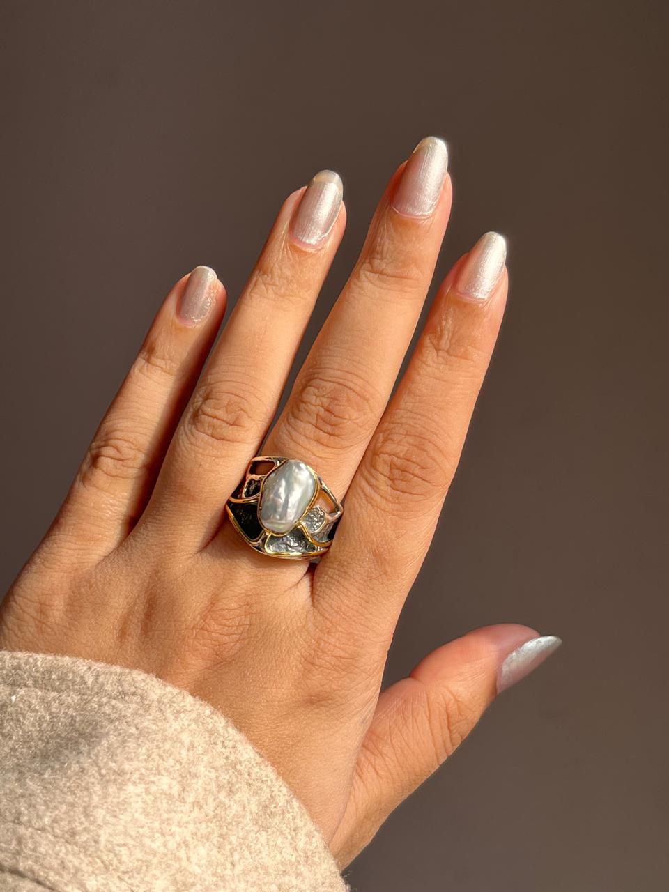 Vintage-inspired rustic silver ring featuring a pair of Baroque pearls.