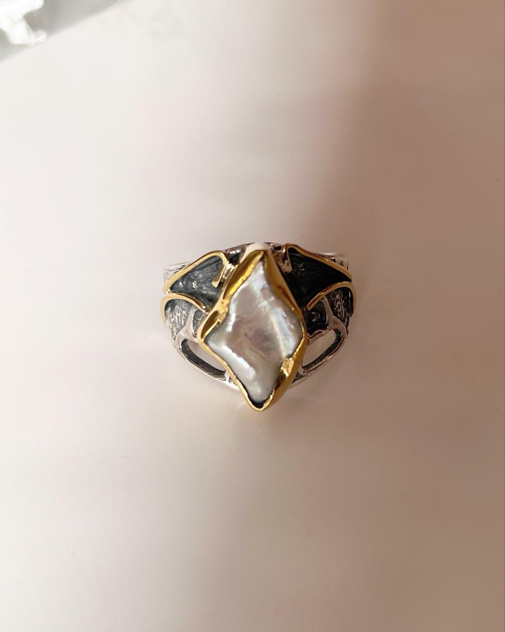 Elegant silver ring with two Baroque pearls in a rustic design.
