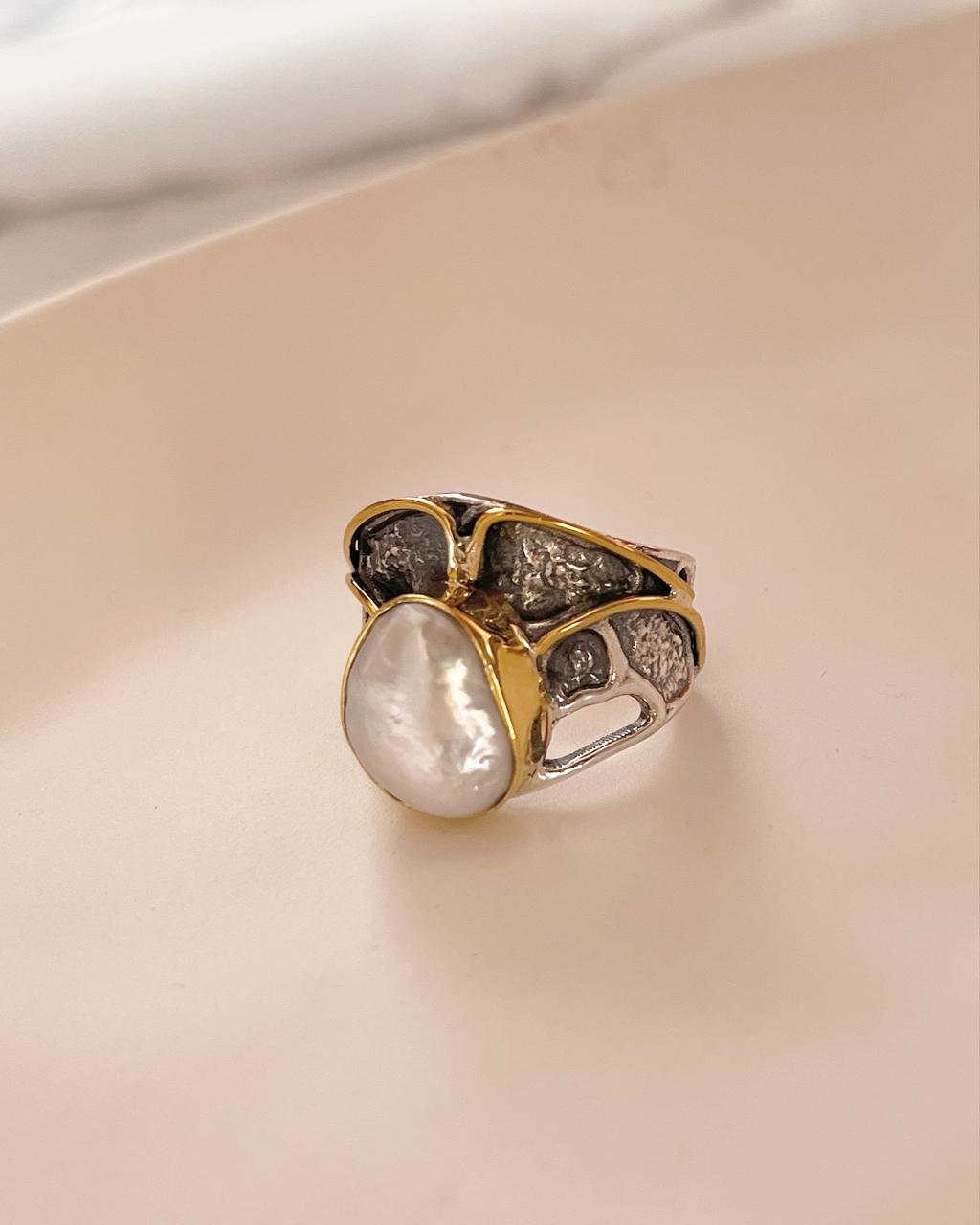 Elegant silver ring with two Baroque pearls in a rustic design.