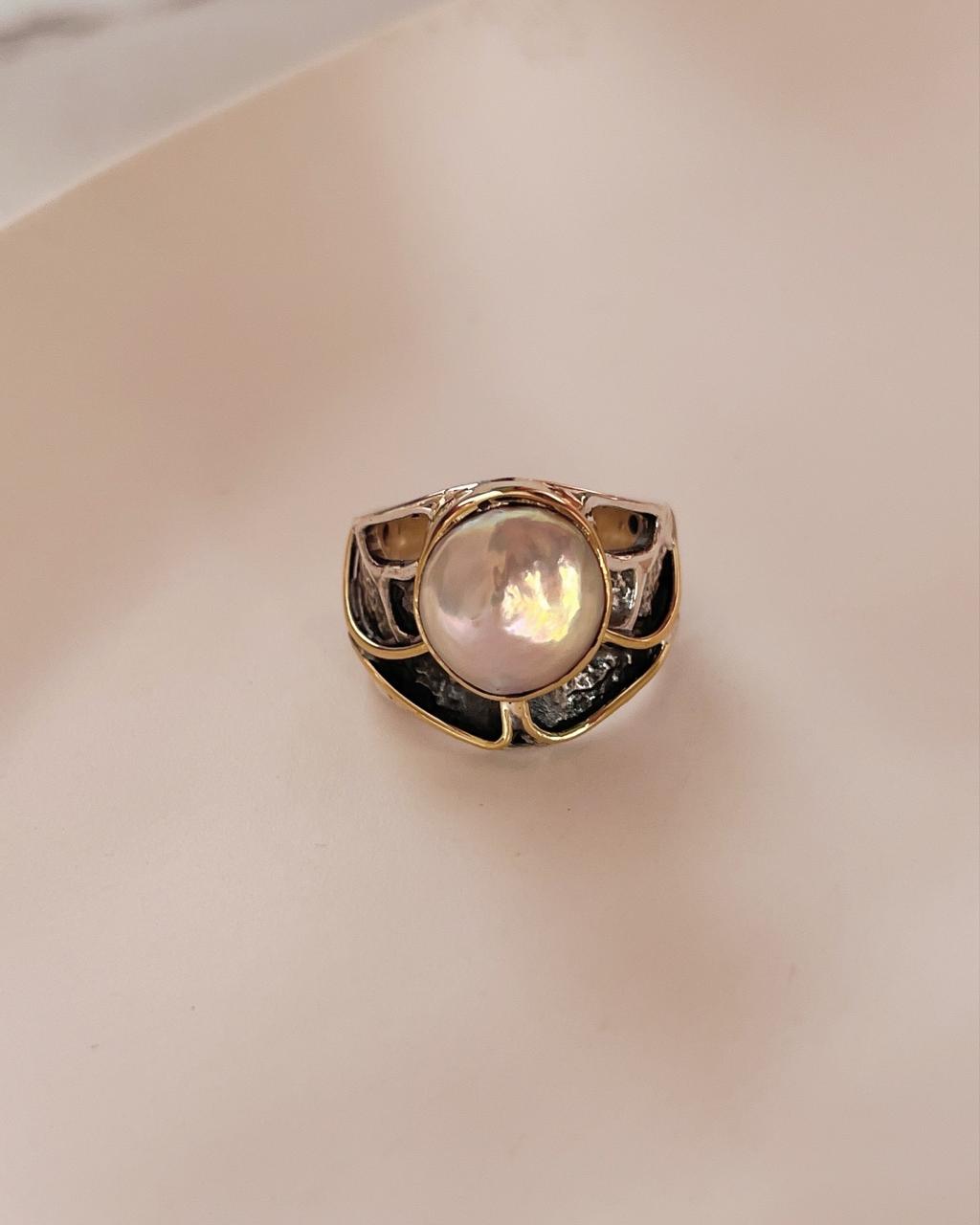 Vintage-inspired rustic silver ring featuring a pair of Baroque pearls.