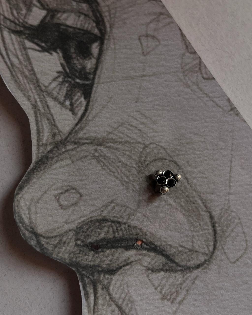 Tribal silver nose pin featuring black CZ stone with wired back design