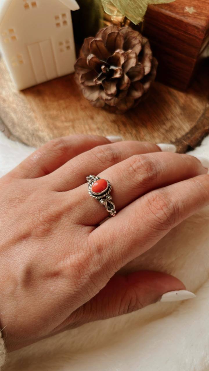 Close-up of Coral 925 Silver Ring featuring oval-shaped gemstone