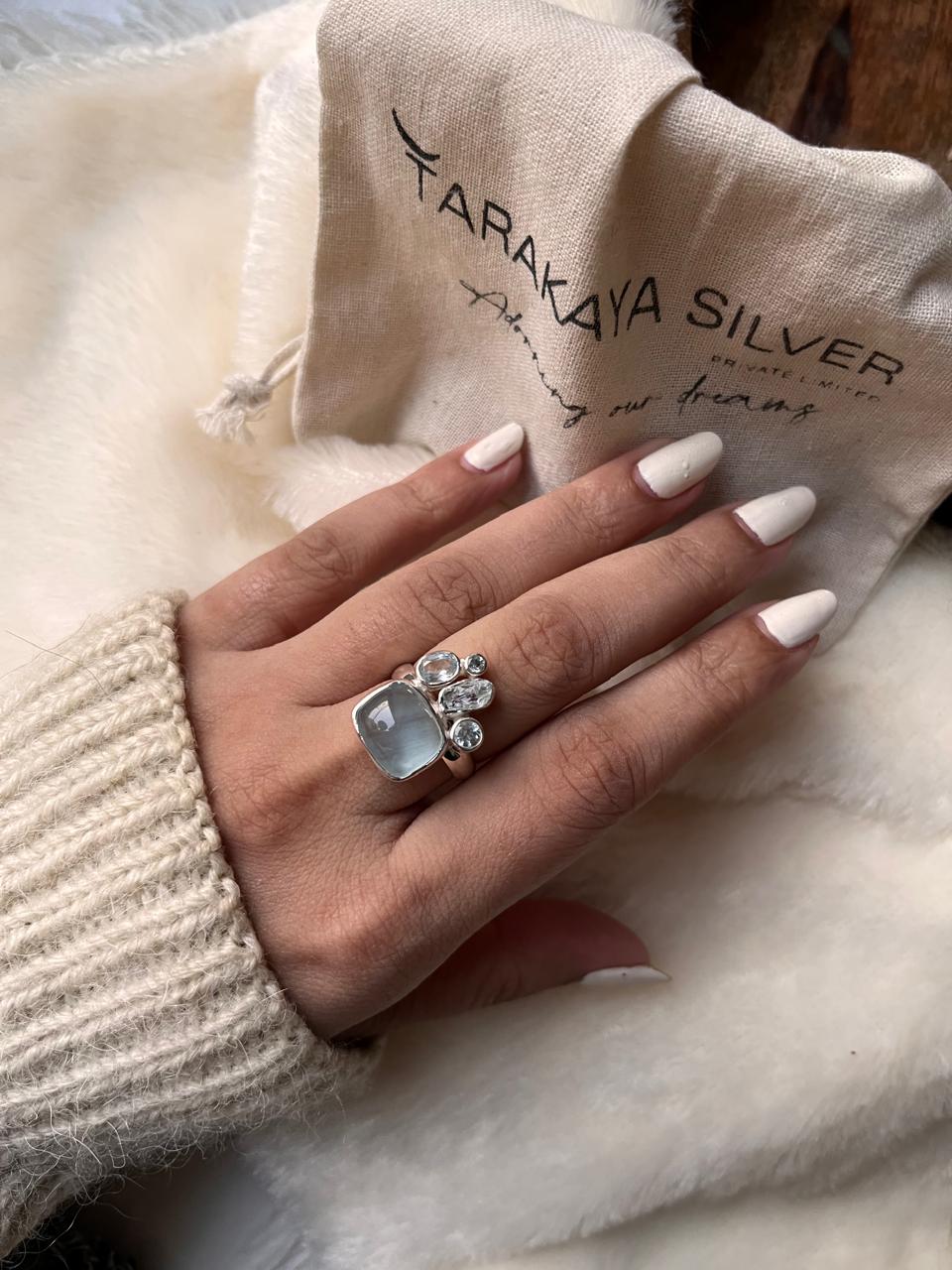 925 silver ring featuring a single aquamarine and blue topaz cluster