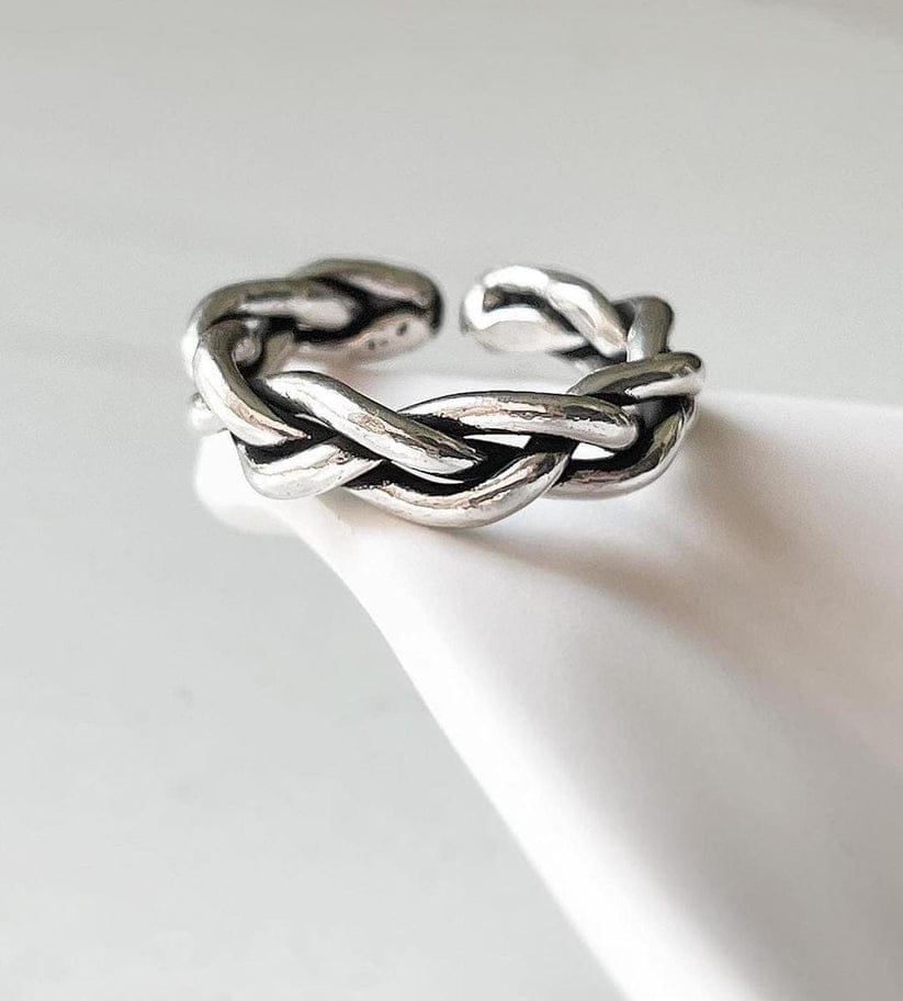 Close-up of chunky twist braided silver ring with adjustable band