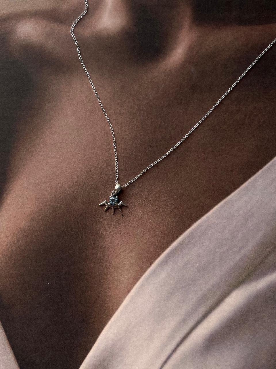 Handcrafted Blue Topaz Evil Eye Necklace with Silver Detail