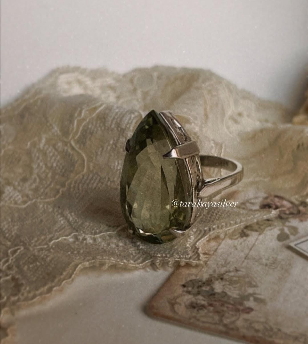 Sterling silver solitaire ring with vibrant green amethyst