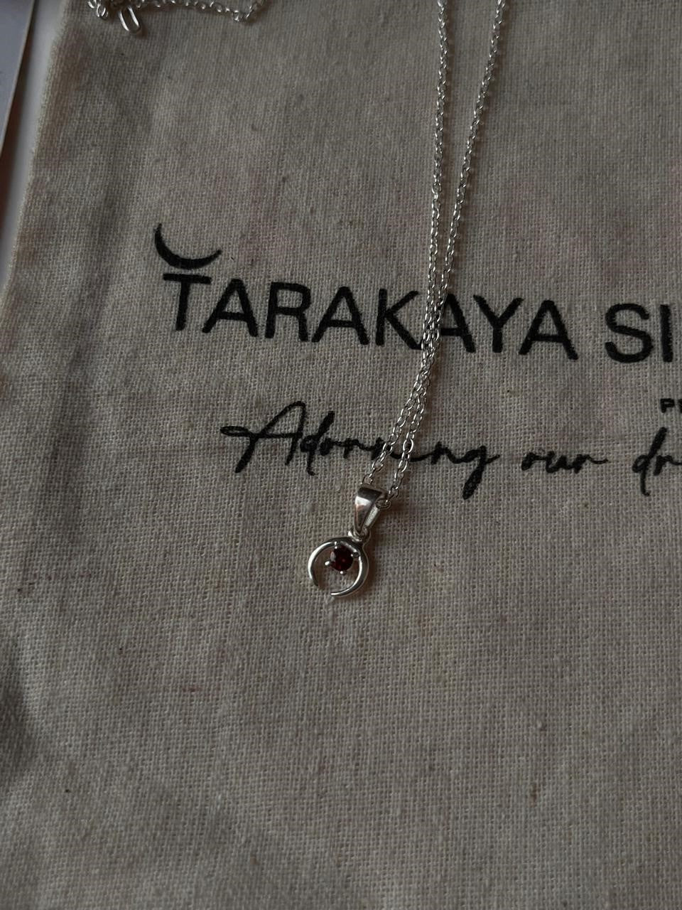 Delicate crescent moon necklace with garnet in sterling silver