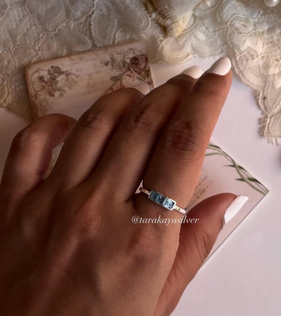 Elegant 3-stone blue topaz band in sterling silver