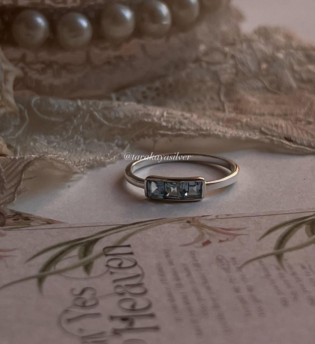 Handcrafted blue topaz silver ring with 3-stone design