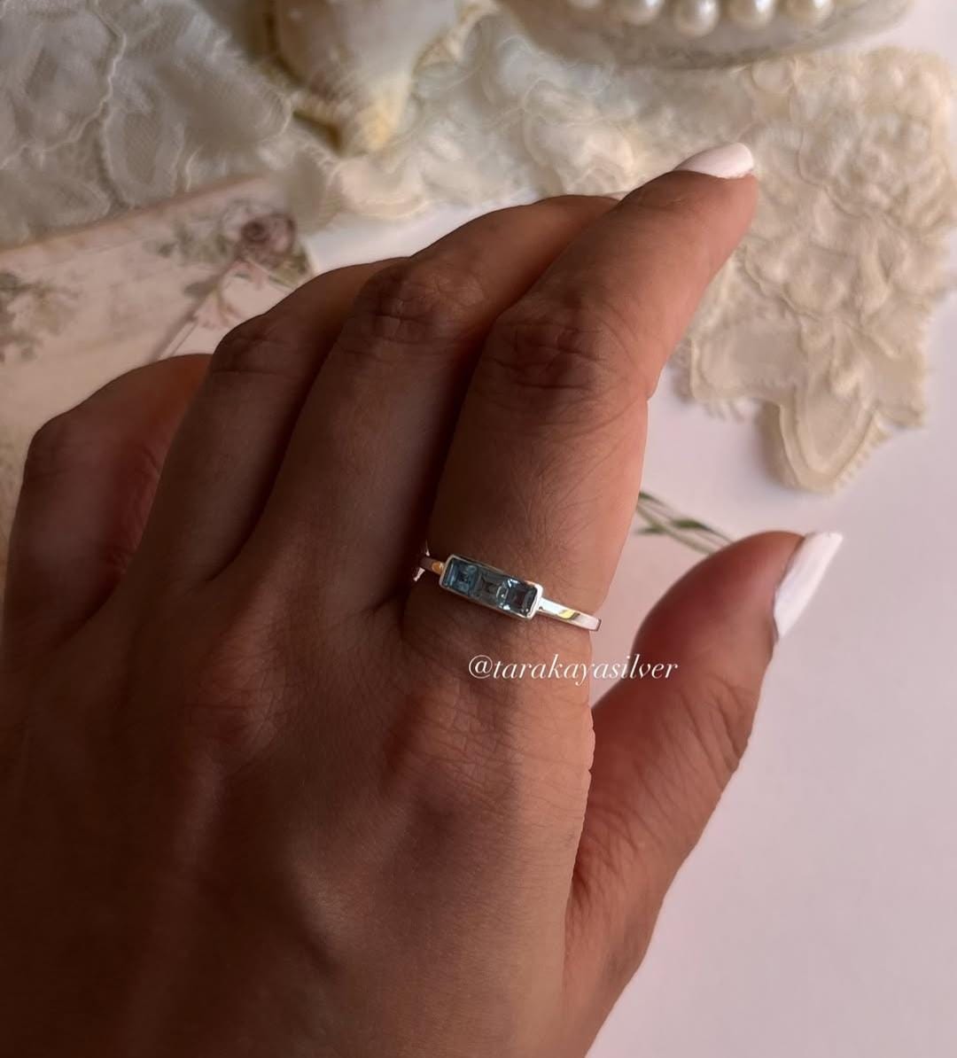 Minimalist three stone blue topaz ring in silver