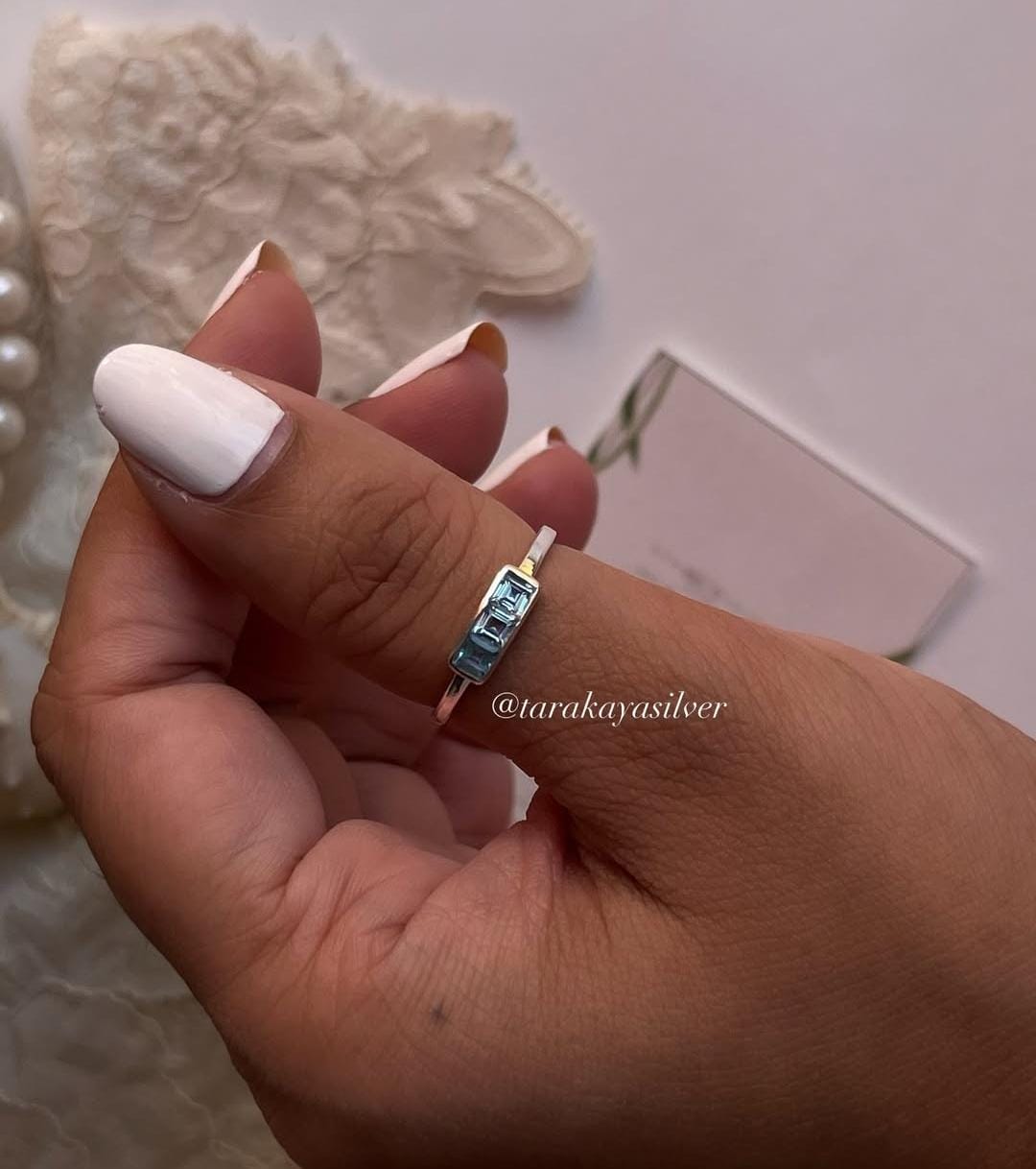 Pretty silver band with blue topaz trio stones