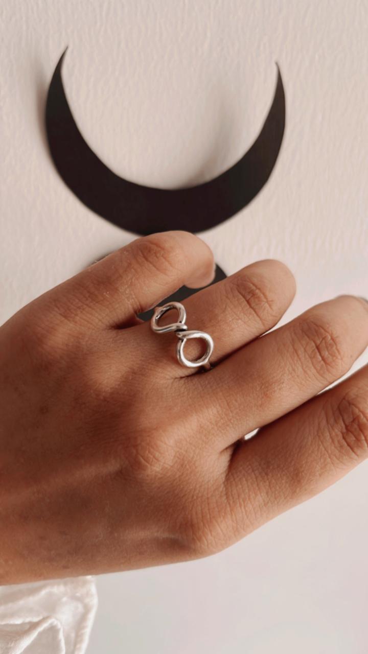 Elegant silver ring with infinity twist design
