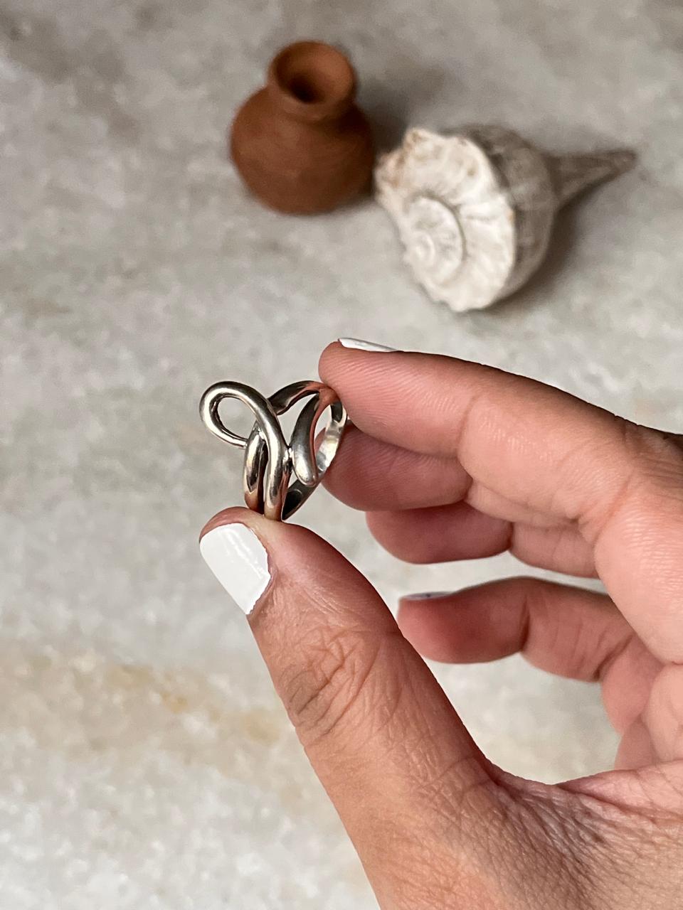 Bold silver knot ring with sleek sculpted finish