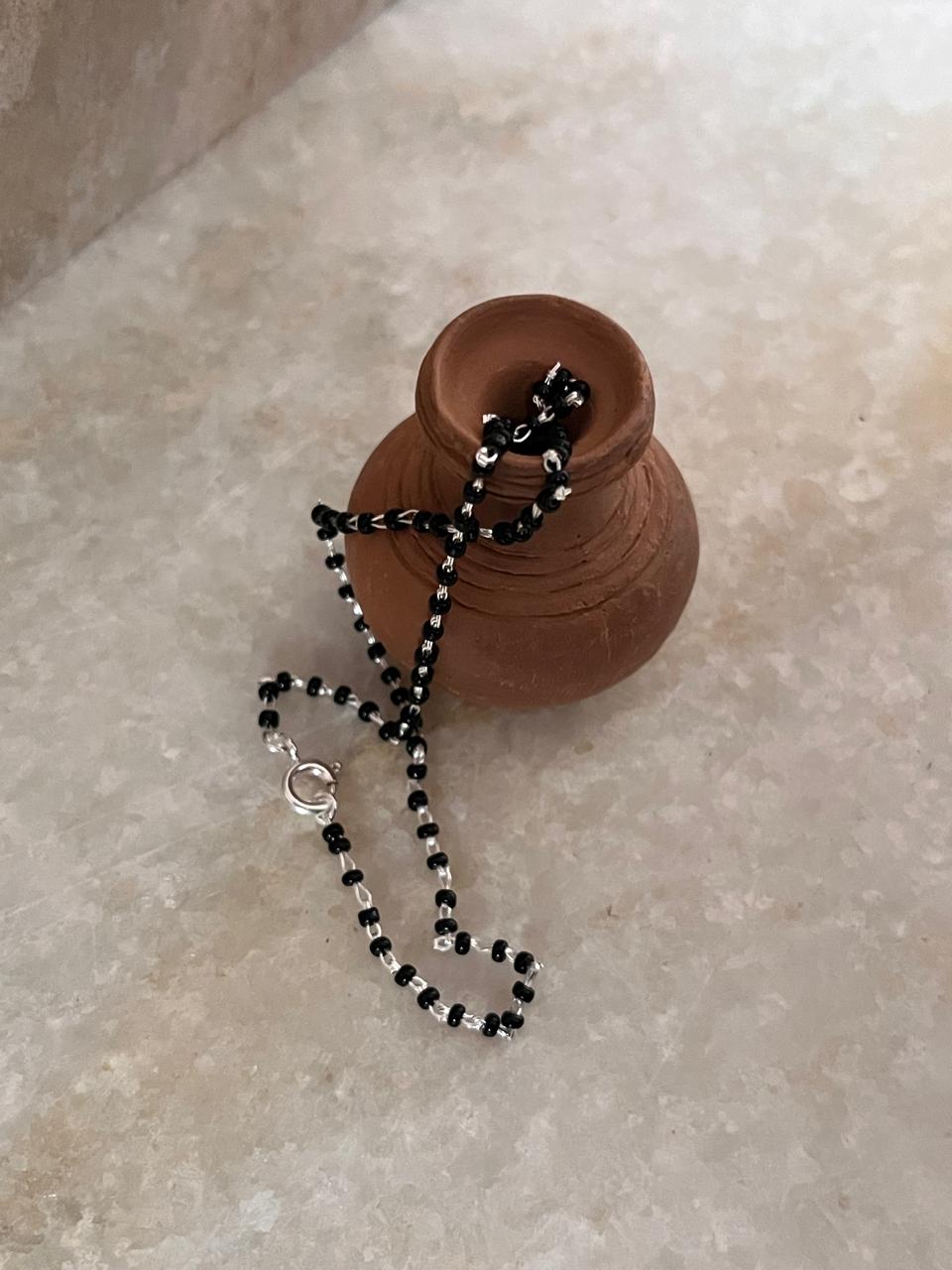Traditional nazariya silver anklet with black beads